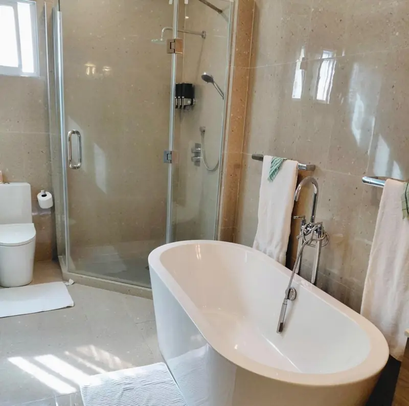 Bathroom with a free-standing tub and glass shower