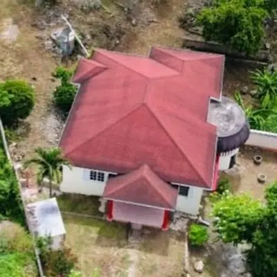 Aerial view of the red-roofed house Dr. A. Mereno and her husband bought with Tiffany